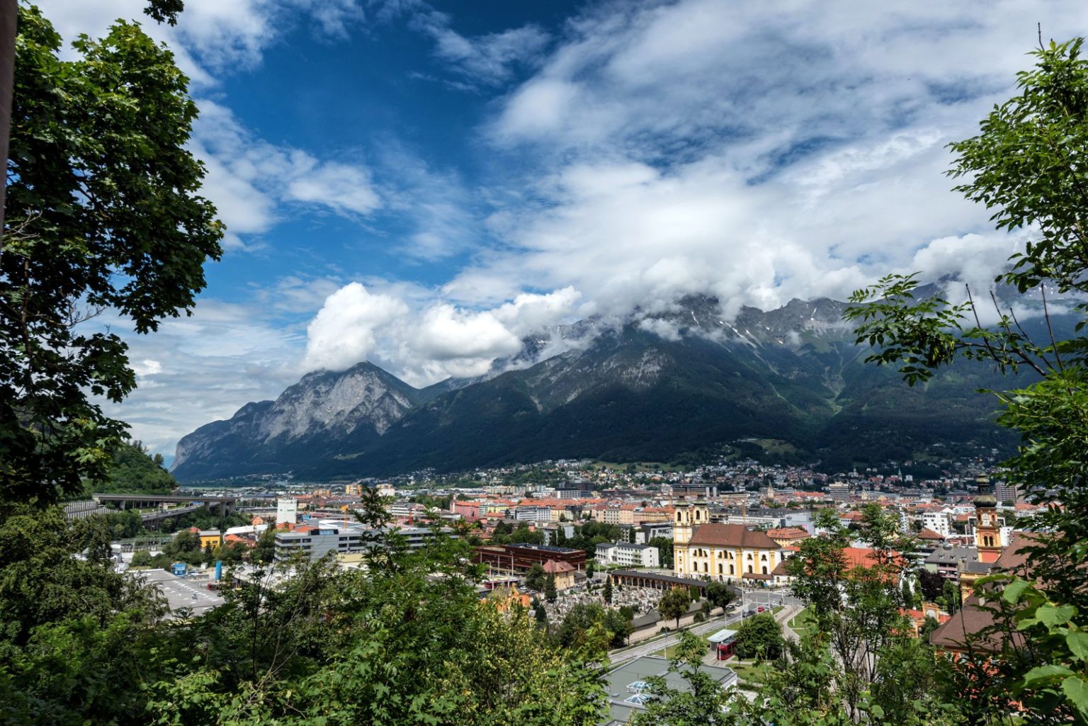 Beautiful view of Innsbruck, Austria with mountains and clouds in the background