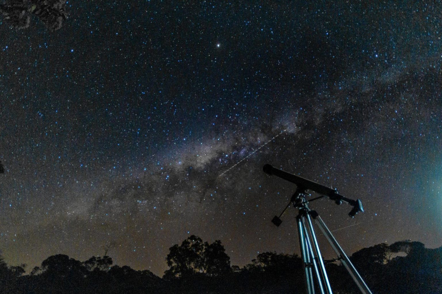 Two UK destinations named among Europe’s best for stargazing holidays Telescope on a tripod beneath the Milky Way in a clear dark night sky